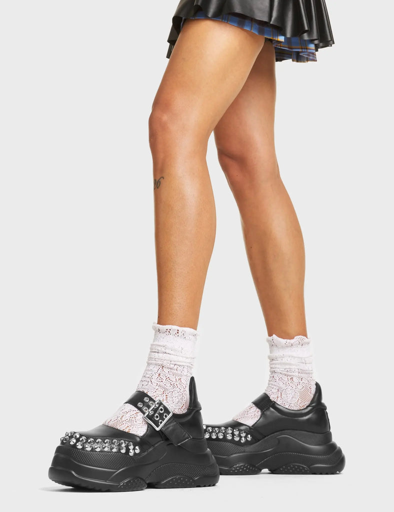 Up To My Neck Chunky Platform Sneakers in Black faux leather. These Chunky Sneakers feature Mary Jane design with a thick strap over the foot and a silver square-shaped buckle. They also feature silver stud detailing. Made with eco-friendly materials and 100% cruelty-free!