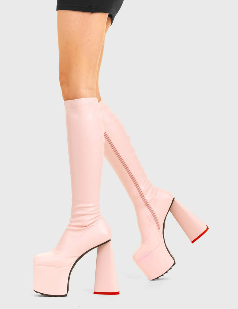 PEACE AND LOVE Wild Child Platform Knee High Boots in Pink Fitted Faux Leather. These vegan western Boots feature heart shaped heel, with a red sole and shark teeth grips, very classy. Made with eco-friendly materials and 100% cruelty-free, these boots are as ethical as they are edgy! - Chunky Platform - Knee length - Shark teeth grip - Fitted feel - Heart shaped heel - Red heel sole - Rounded toe - 100% vegan SKU: LMF 3633 - PinkStretchPU