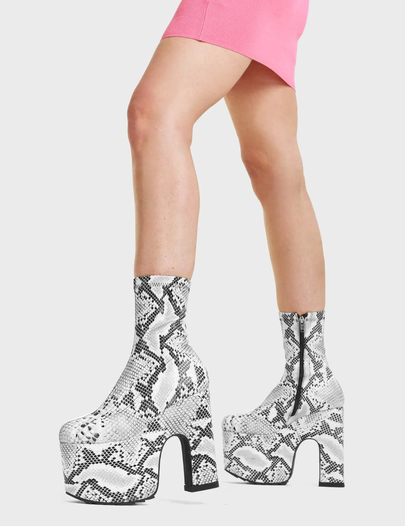 Above Snakes Chunky Platform Ankle Boots feature a unique snake pattern design.