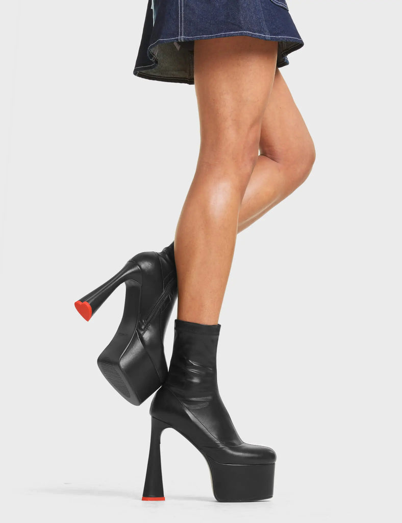 CAN'T STOP

Addicted Platform Ankle Boots in Black stretch faux leather. These platform boots feature on our platform sole in additon to a heart shaped heel with a red heart at the bottom. reach new heights in your fashion game. Made with eco-friendly materials and 100% cruelty-free, these platform boots are as ethical as they are on point.

- Platform Height
- Heel Height
- Zipper
- Stretchy Material
- Ankle Length
- Platform sole
- Heart Heel
- Heart Detail
- 100% vegan

SKU: LMF 4467 - BlackStretchPU