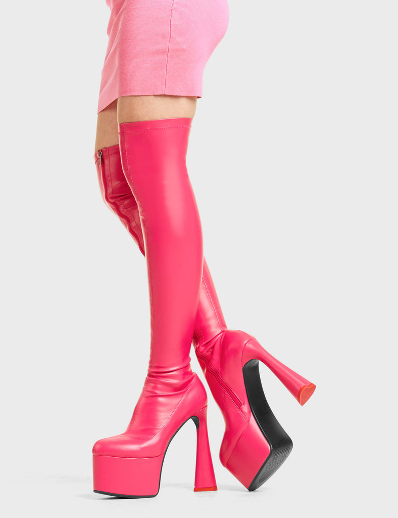 RING RING 
 
 Answer Platform Thigh High Boots in fuchsia faux leather. These platform boots feature a minimalist design with a fitted feel, on our platform sole and high heel. Also features a heart shaped heel with a red heart at the bottom. Made with eco-friendly materials and 100% cruelty-free, these platform boots are as ethical as they are eye-catching.
 
 - Platform Height
 - Heel Height
 - Fuchsia Zip
 - Fitted feel
 - High Heel
 - Platform Sole
 - Red Heart
 - 100% vegan
 
 SKU: LMF 4476 - FuchsiaPU