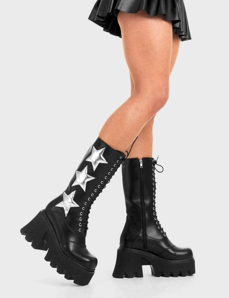 STARRY NIGHT
 
 Big League Chunky Platform Calf Boots in Black faux leather. These vegan western Boots feature a black lace up boot with silver stars , very classy. Made with eco-friendly materials and 100% cruelty-free, these boots are as ethical as they are edgy!
 
  
 - Chunky Platform
 - Calf length
 - Lace up
 - Silver stars
 - Rounded toe 
 - 100% vegan 
 
 SKU: LMF 3607 - BlackPU/SilverStar