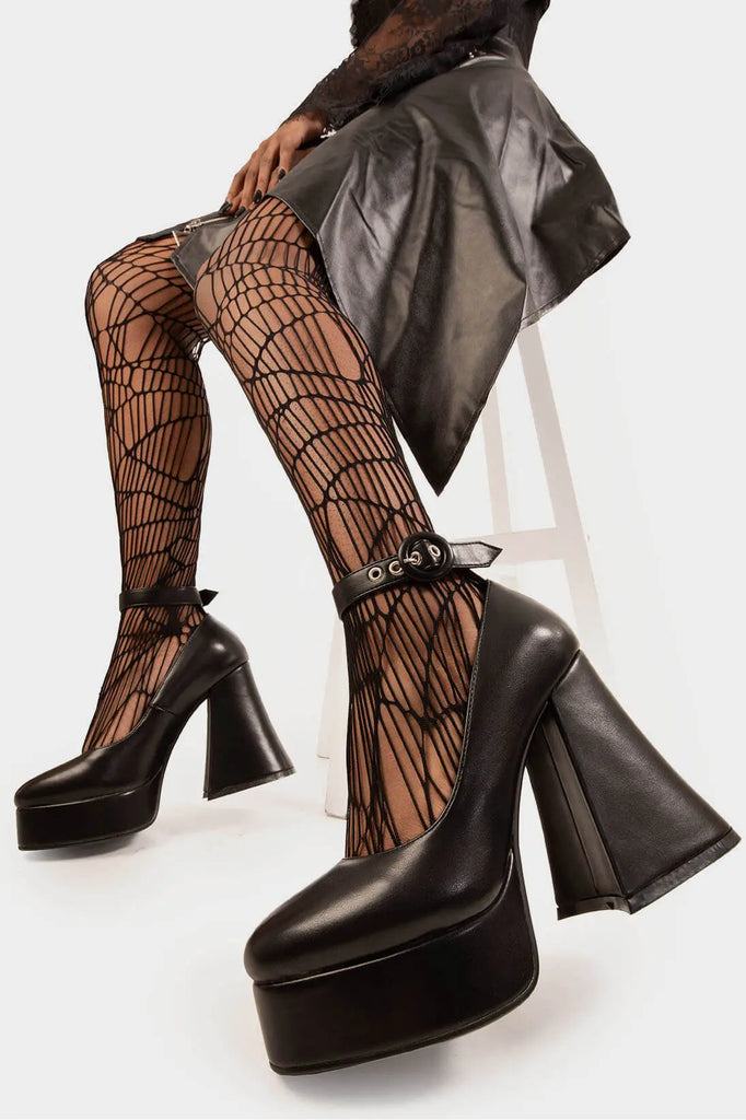 Elevated Elegance.

Build Me Up Platform Heels in Black faux leather. These vegan Platform Heels feature a adjustable black ankle strap with a "O" ring buckle and silver eyelets, stepping into sophistication. Made with eco-friendly materials and 100% cruelty-free, these heels are as ethical as they are elegant!

- Platform Height: 2.6 inch
- Heel Height: 5.5 inch
- Adjustable black strap
- Silver eyelets 
- "O" ring buckle
- Platform sole
- Flared heel
- Round toe
- 100% vegan

SKU: LMF 1707 - BlackPU