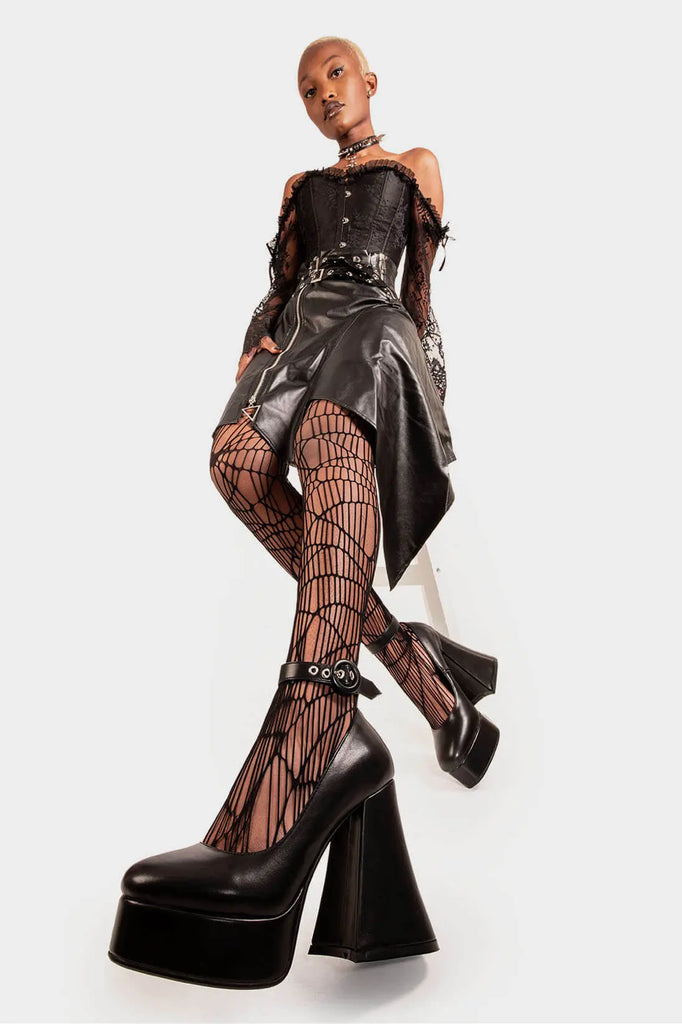 Elevated Elegance.

Build Me Up Platform Heels in Black faux leather. These vegan Platform Heels feature a adjustable black ankle strap with a "O" ring buckle and silver eyelets, stepping into sophistication. Made with eco-friendly materials and 100% cruelty-free, these heels are as ethical as they are elegant!

- Platform Height: 2.6 inch
- Heel Height: 5.5 inch
- Adjustable black strap
- Silver eyelets 
- "O" ring buckle
- Platform sole
- Flared heel
- Round toe
- 100% vegan

SKU: LMF 1707 - BlackPU