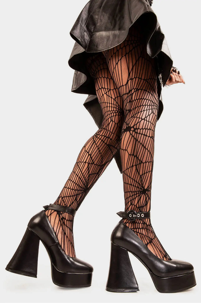 Elevated Elegance.

Build Me Up Platform Heels in Black faux leather. These vegan Platform Heels feature a adjustable black ankle strap with a "O" ring buckle and silver eyelets, stepping into sophistication. Made with eco-friendly materials and 100% cruelty-free, these heels are as ethical as they are elegant!

- Platform Height: 2.6 inch
- Heel Height: 5.5 inch
- Adjustable black strap
- Silver eyelets 
- "O" ring buckle
- Platform sole
- Flared heel
- Round toe
- 100% vegan

SKU: LMF 1707 - BlackPU