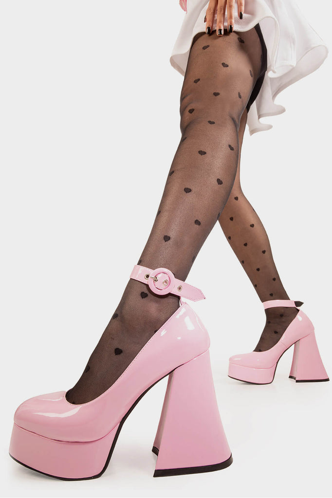 Elevated Elegance.

Build Me Up Platform Heels in Pink Patent faux leather. These vegan Platform Heels feature a adjustable pink patent ankle strap with a "O" ring buckle and silver eyelets, stepping into sophistication. Made with eco-friendly materials and 100% cruelty-free, these heels are as ethical as they are elegant!

- Platform Height: 2.6 inch
- Heel Height: 5.5 inch
- Adjustable pink patent strap
- Silver eyelets 
- Platform sole
- Flared heel
- Round toe
- 100% vegan

SKU: LMF 1707 - PinkPAT