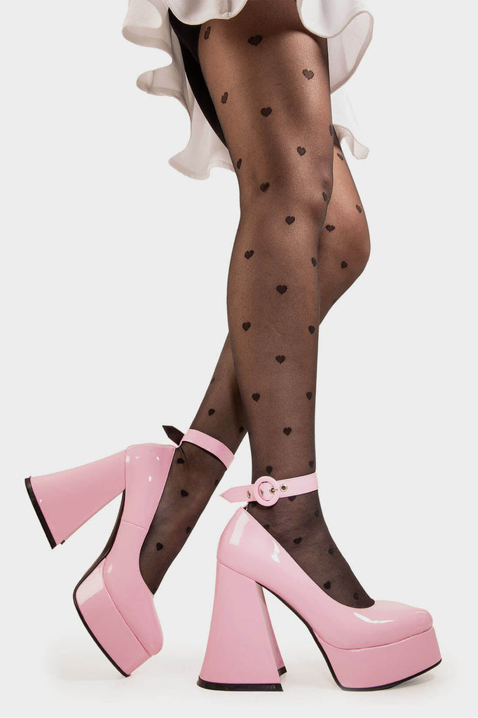 Elevated Elegance.

Build Me Up Platform Heels in Pink Patent faux leather. These vegan Platform Heels feature a adjustable pink patent ankle strap with a "O" ring buckle and silver eyelets, stepping into sophistication. Made with eco-friendly materials and 100% cruelty-free, these heels are as ethical as they are elegant!

- Platform Height: 2.6 inch
- Heel Height: 5.5 inch
- Adjustable pink patent strap
- Silver eyelets 
- Platform sole
- Flared heel
- Round toe
- 100% vegan

SKU: LMF 1707 - PinkPAT