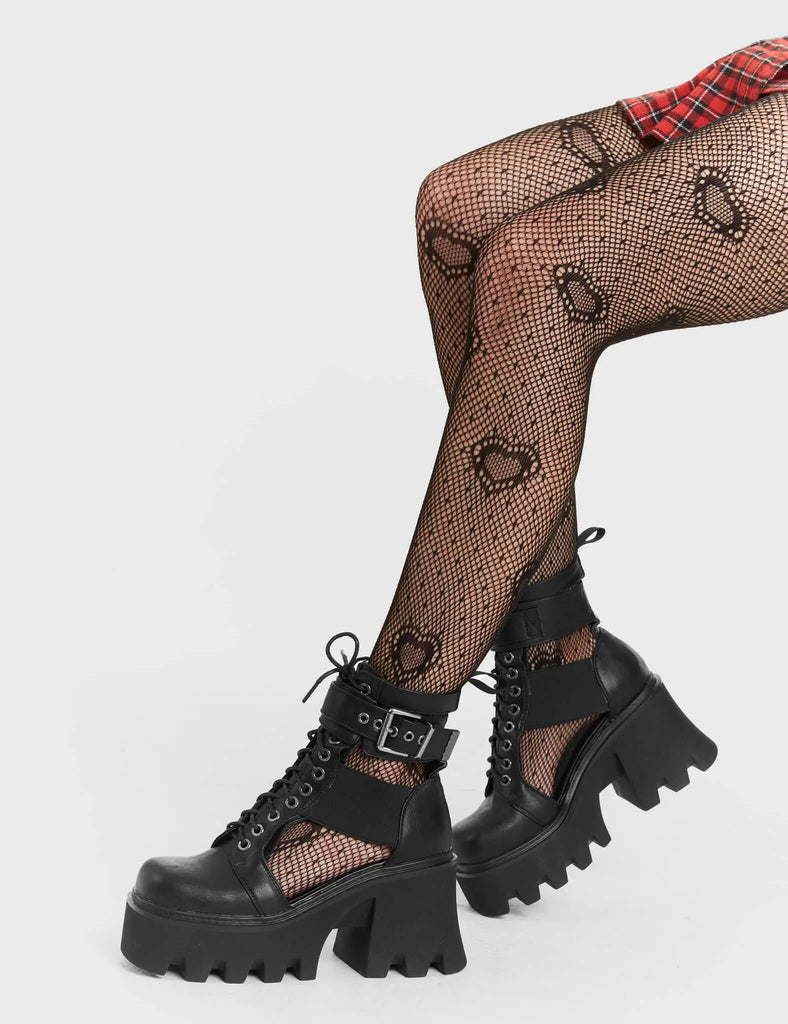 Vacation Vibes
 
 Busy Chunky Platform Ankle Boots in Black faux leather. These Black vegan Boots feature an adjustable lace up details with cut out detail on the side of the boot, relax in style and comfort. Made with eco-friendly materials and 100% cruelty-free.
 
 
 - Platform Height: 3.3 inch
 - Guseet detail
 - Wide ankle and calf friendly 
 - Black zipper
 - Black laces and silver eyelets 
 - Cut out detail
 - Chunky sole
 - Round Toe
 - 100% vegan 
 
 SKU: LMF 1245 - BlackPU