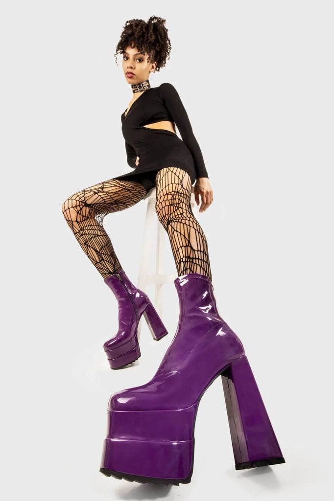 Runway Ready
  
 Cassette Platform Ankle Boots in Purple Patent faux leather. These purple vegan Platform boots feature on our double stack platform sole, sleek and stylish to own your runway! Made with eco-friendly materials and 100% cruelty-free, these platform boots are as ethical as they are runway worthy!
 
 
 - Platform Height
 - Heel Height
 - Purple Zipper 
 - Shark's teeth rubber grip 
 - Chunky platform sole
 - Square Toe
 - 100% vegan 
 
 SKU: LMF 2141 - PurplePAT