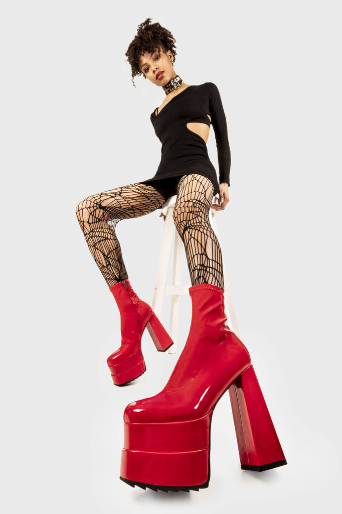 Runway Ready
  
 Cassette Platform Ankle Boots in Red Patent faux leather. These red vegan Platform boots feature on our double stack platform sole, sleek and stylish to own your runway! Made with eco-friendly materials and 100% cruelty-free, these platform boots are as ethical as they are runway worthy!
 
 
 - Platform Height
 - Heel Height
 - Red Zipper 
 - Shark's teeth rubber grip 
 - Chunky platform sole
 - Square Toe
 - 100% vegan 
 
 SKU: LMF 2141 - RedPAT