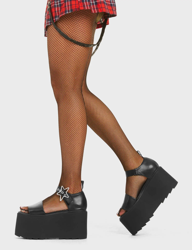 HOT VIBES

Celestial Chunky Platform Sandals in Black faux leather. These platform sandals feature an adjustable strap across the upper with silver eyelets and a star shaped buckle, embrace the summer and make hot statments. Made with eco-friendly materials and 100% cruelty-free, these platform boots are ethical and HOT!

- Platform Height
- Heel Height
- Adjustable strap
- Silver eyelets with Star shaped buckle
- Chunky Platform sole
- Shark's teeth grip
- Round Toe
- 100% vegan

SKU: LMF 4537 - BlackPU