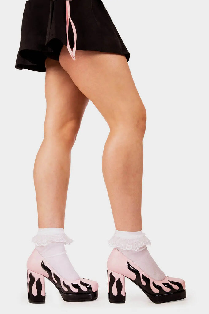 Honey I'm home
 
 Changed Platform Heels in Pink Patent faux leather. These pink vegan Platform Heels feature a black patent flame up the sole and heel, for your feet's sweet retreat. Made with eco-friendly materials and 100% cruelty-free, these platform boots are as ethical as they are blissful.
 
 - Platform Height
 - Heel Height
 - Black patent flame 
 - Platform sole
 - Square Toe
 - 100% vegan 
 
 SKU: LMF 2158 - Pink/Flame