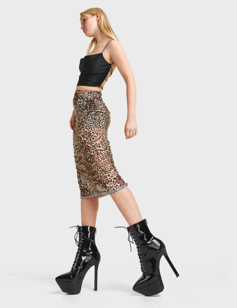 Cool Kids Platform Ankle Boots in Black Patent. Feature black laces with silver eyelets, on a pointed platform heel.