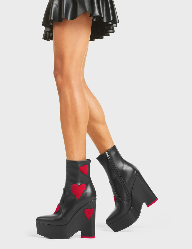 DARK LOVE
 
 Copacetic Chunky Platform Ankle Boots in Black faux leather. These platform boots feature big dark red hearts with a platformed wedge. Also features a red heart on the heel. Made with eco-friendly materials and 100% cruelty-free, these platform boots are as ethical as they are chic.
 
 - Platform Height
 - Ankle Length
 - Dark Red hearts
 - Rounded Toe
 - High Heel
 - 100% Vegan
 
 SKU: LMF 5237 - BlackPU/DarkRed