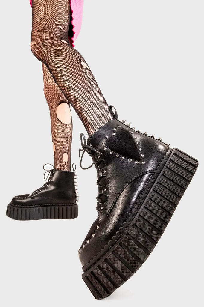 Love Bound 
 
 Cross Your Heart Chunky Ankle Creeper Boots in Black faux leather. These classic creeprs feature two black suede hearts with silver studs and adjustable lace up feature, spreading the love with every step. Made with eco-friendly materials and 100% cruelty-free.
 
 
 - Platform Height: 2.3 inch
 - Low ankle length
 - Black suede hearts
 - Silver studs
 - Silver spiked studs
 - Lace up
 - Chunky Platform Creeper sole
 - Round toe 
 - 100% vegan 
 
 SKU: LMF 0885 - BlackPU/BlackHeart