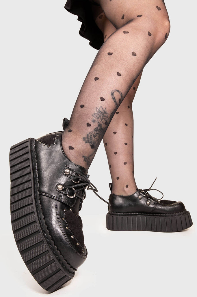 Solemates
 
 Cryptic Love Chunky Creeper Shoes in Black faux leather. These Black vegan creeper shoes feature two black suede hearts on the upper and to the side of the shoe , falling in love one step at a time. Made with eco-friendly materials and 100% cruelty-free, these creeper shoes are as ethical as they are loveable!
 
 
 - Platform Height: 2.3 inch
 - Black laces 
 - Silver eyelets
 - Black suede hearts
 - Silver studs 
 - Chunky Creeper sole
 - Round Toe
 - 100% vegan 
 
 SKU: LMF 1582 - BlackPU