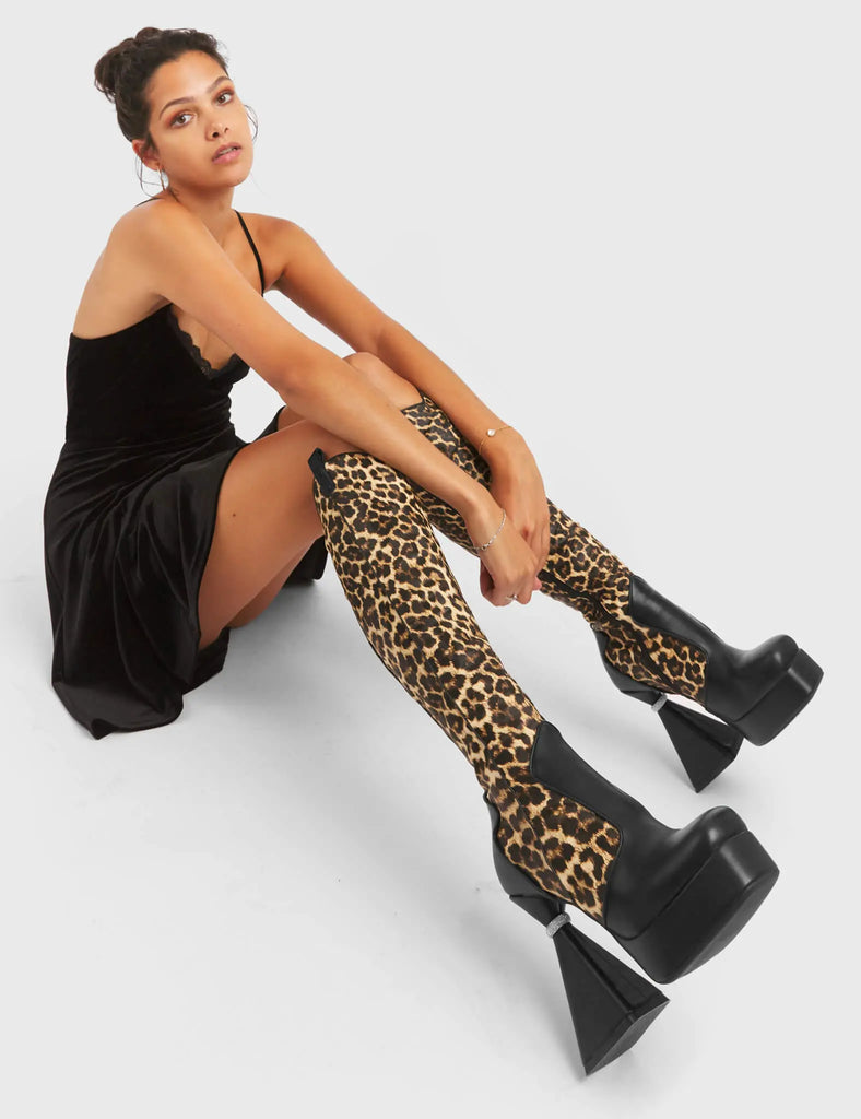 UNFORGETTABLE
 
 Curious Platform Knee High Boots in black and leopard faux leather. These platform boots feature a chic look with a flared heel that includes silver ring detailing on the heel, keeping it nice and classy. These heels also feature a functional zip on the leopard detailed upper. Made with 100% vegan materials. 
 
 - Platform Height
 - Leopard Design
 - Functional Zip
 - Flared Heel
 - Silver Ring Detail
 - Round Toe
 - 100% vegan
 
 SKU: LMF 5442 - BlackPU/Leo