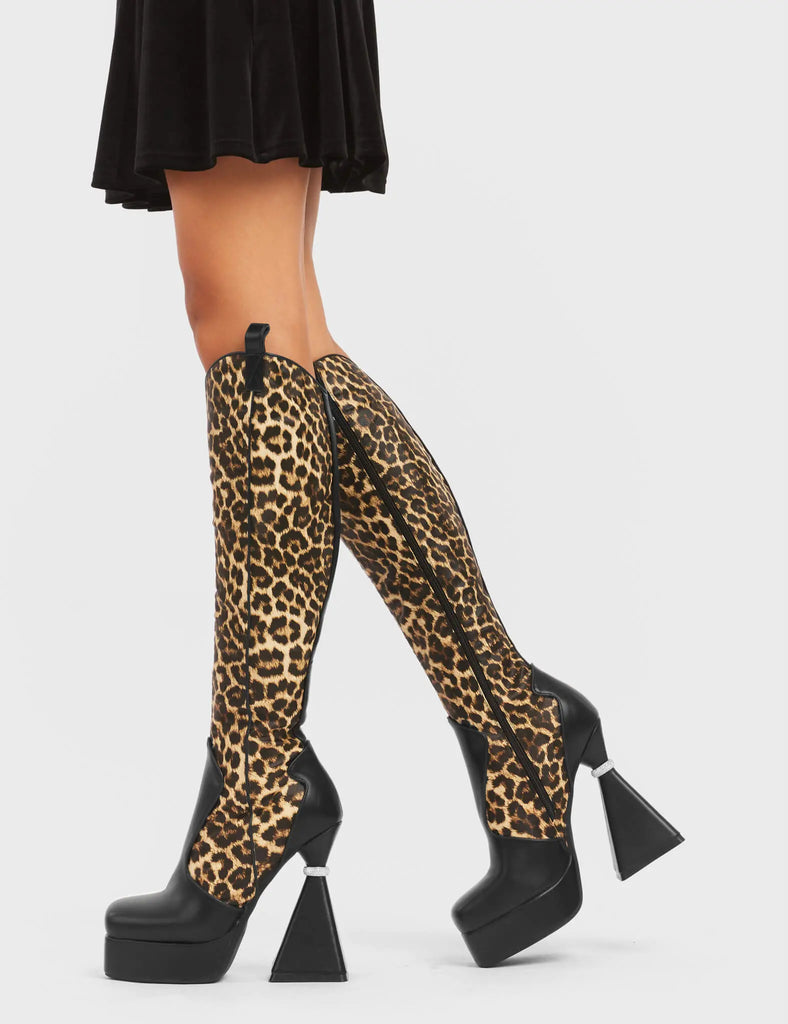 UNFORGETTABLE
 
 Curious Platform Knee High Boots in black and leopard faux leather. These platform boots feature a chic look with a flared heel that includes silver ring detailing on the heel, keeping it nice and classy. These heels also feature a functional zip on the leopard detailed upper. Made with 100% vegan materials. 
 
 - Platform Height
 - Leopard Design
 - Functional Zip
 - Flared Heel
 - Silver Ring Detail
 - Round Toe
 - 100% vegan
 
 SKU: LMF 5442 - BlackPU/Leo