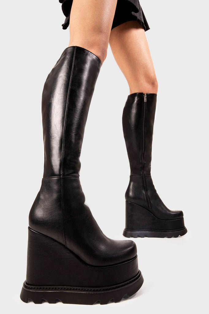 Ground Breakers
 
 Deep Seas Chunky Platform Knee High Boots in Black faux leather. These black platform boots feature on our chunky platform wedge sole, leave your fashion mark. Made with eco-friendly materials and 100% cruelty-free, these platform boots are as ethical as they are Ground breaking!
 
 - Platform Height
 - Heel height
 - Black zipper
 - Chunky platform wedge sole
 - Round Toe 
 - 100% vegan 
 
 SKU: LMF 2204 - BlackPU