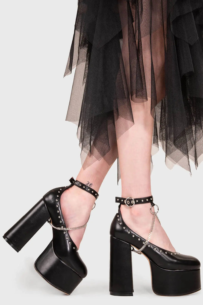 THE SHOEDROBE STAPLE
 
 Watch Me Chunky Mary Jane Shoes in Black faux leather. These Mary Janes feature a Chunky and comfortable Platform sole. Everyone needs a pairs of Mary Janes! Made with eco-friendly materials and 100% cruelty-free, these Sandals are as ethical as they are cute!
 
 
 - Platform Height: 3 inch
 - T Bar structure
 - Square buckle and silver eyelets
 - Chunky Platform sole
 - Round toe 
 - 100% vegan 
 
 SKU: LMS 194 - BlackPU