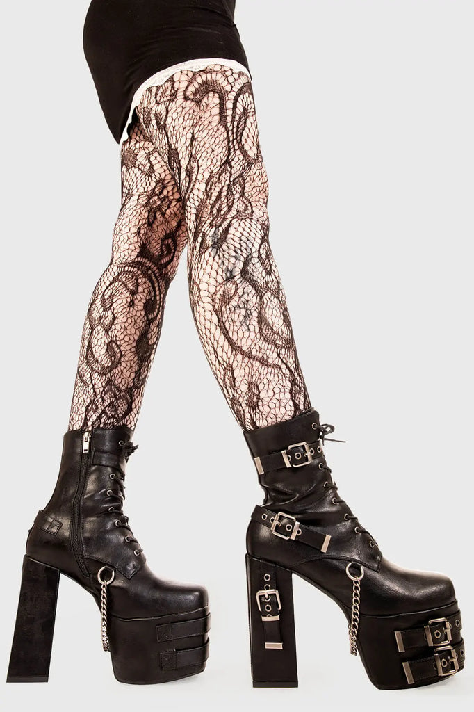 Strapped Up.
 
 Dilligence Chunky Platform Ankle Boots in Black faux leather. These Boots feature lace up detail with two adjustable straps around the ankle and three across the sole and heel. Made with eco-friendly materials and 100% cruelty-free
 
 - Platform Height: 2.5 inch
 - Heel Height: 5.5 inch 
 - Mid ankle length
 - Black zipper 
 - Black strap and silver eyelets
 - Square shaped buckles 
 - Silver chain
 - Chunky Platform sole
 - Round Toe
 - 100% vegan 
 
 SKU: LMF 1862 - BlackPU