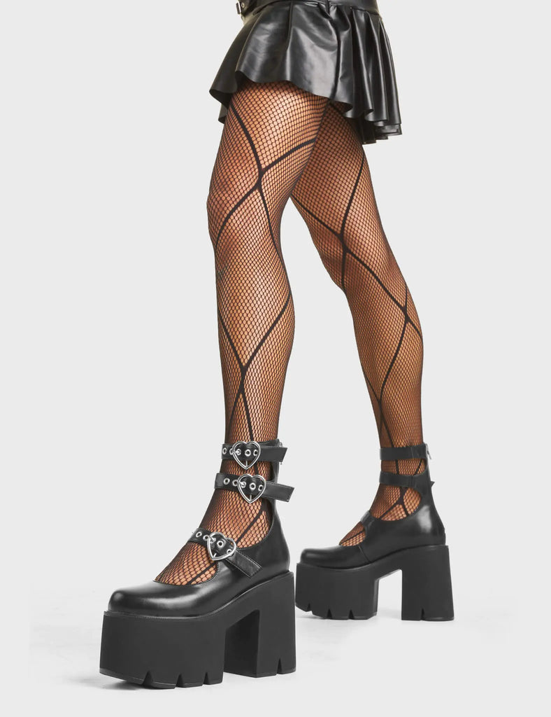 UNSTOPPABLE
 
 Don't Stop Me Chunky Platform Ankle Boots in Black faux leather. These platform boots feature three adjustable straps with silver heart buckles and eyelets. Made with eco-friendly materials and 100% cruelty-free, these platform boots are as ethical as they are chic.
 
 - Platform Height
 - Three Adjustable Straps
 - Silver Buckles
 - Silver Eyelets
 - Chunky Sole
 - Round Toe
 - 100% vegan
 
 SKU: LMF 4858 - BlackPU