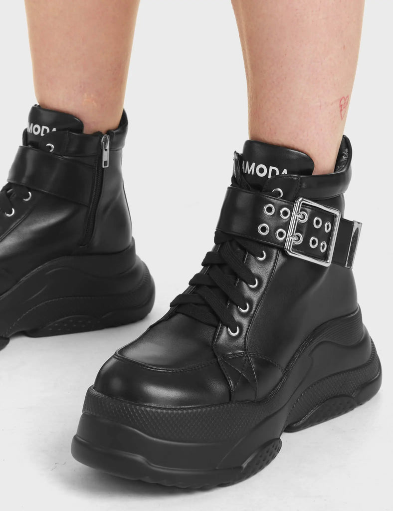 Eerie Chunky Platform Sneakers in Black with 'LAMODA' in white on the tongue of the shoe.