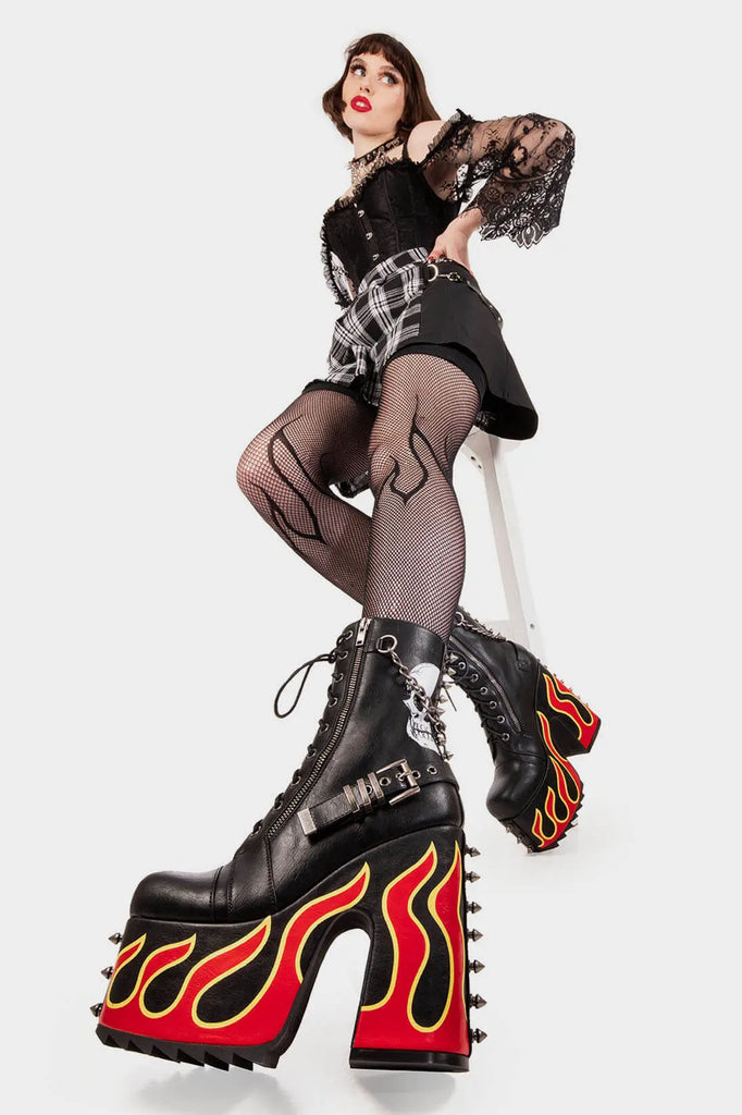 Blazing Trails
 
 Expensive Pain Chunky Platform Ankle Boot in Black faux leather. These black vegan Platform Boots feature a flame design on the sole and skull design on the outer with lace up detail, ignite your style and step into fire fashion. 
 
 
 - Platform Height
 - Heel Height 
 - Silver zipper
 - Flame design
 - Black laces with silver eyelets 
 - Silver spiked studs 
 - Adjustable black strap with silver eyelets
 - Square shaped buckles
 - Silver chain
 
 
 SKU: LMF 2051 - Black/Flame