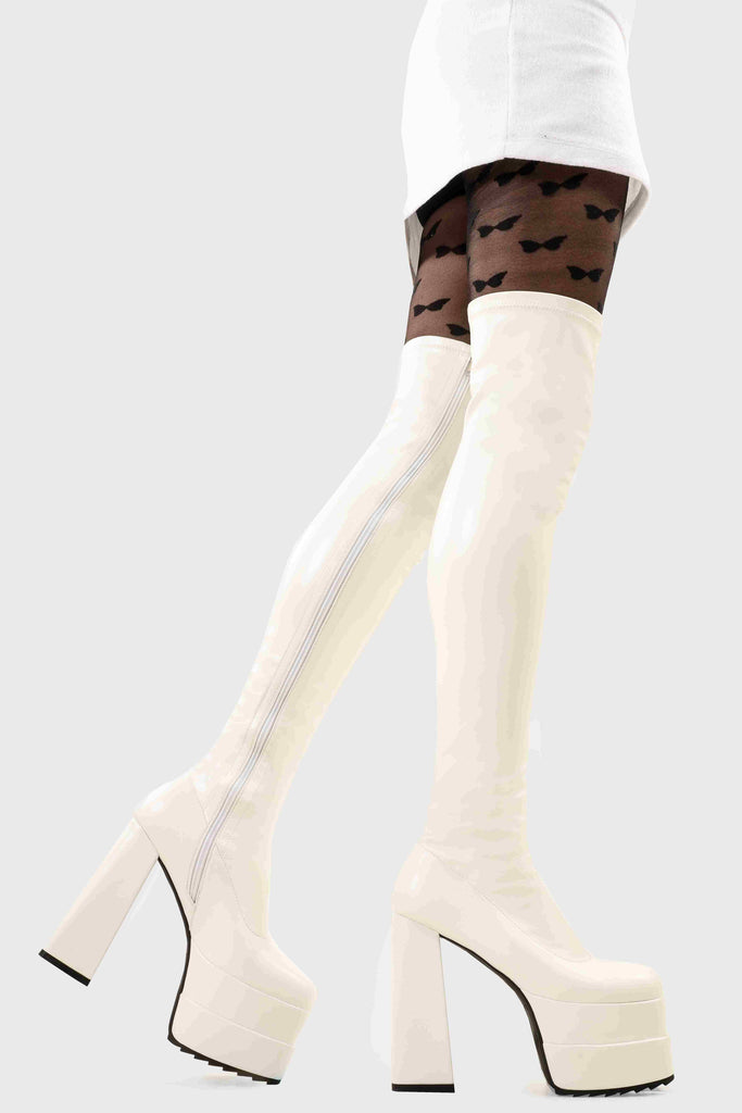 Ground Breaking
 
 Fantasies Platform Thigh High Boots in White Stretch faux leather. These platform boots feature on our double stack platform sole, leave them with a lasting impression. Made with eco-friendly materials and 100% cruelty-free, these platform boots are as ethical as they are Ground Breaking!
 
 - Platform Height
 - Heel Height
 - White Zip 
 - Thigh high length
 - Shark's teeth grip
 - Chunky Platform sole
 - Round Toe 
 - 100% vegan 
 
 SKU: LMF 2698 - WhitePU