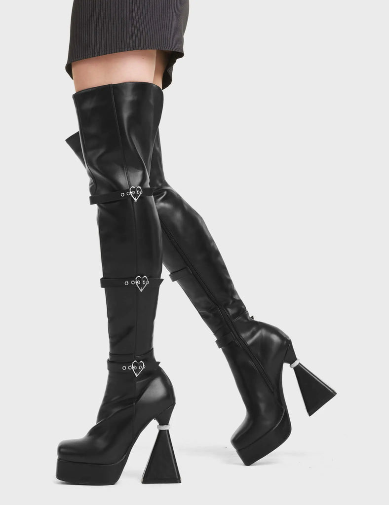 Fantasy Platform Thigh High Boots in Black. Feature heart shaped buckles, on a platform sole with silver ring platform heel.