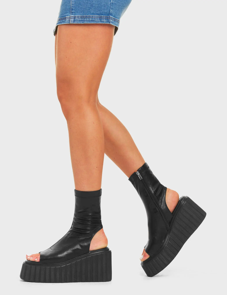RE-ELEVATED
 
 Games Of Luck Chunky Platform Creeper Ankle Boots in Black faux leather. These sandals feature a minimalist design with a open toe design on a ankle length platform boot. Made with eco-friendly materials and 100% cruelty-free, these platform boots are as ethical as they are Charming.
 
 - Platform Height
 - Heel Height
 - Black Zip
 - Ankle Length
 - Open Toe
 - Chunky Platform Creeper Sole
 - Round Toe
 - 100% Vegan
 
 SKU: LMF 4529 - BlackPU