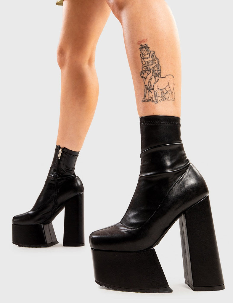 Not Your Basic Boots
 
 Get Out Platform Ankle Boots in Black faux leather. These platform boots feature a minimalist design, with a stretchy fitted feel, the perfect pair with any outfit. Made with eco-friendly materials and 100% cruelty-free, these platform boots are as ethical as they are Cool!
 
 - Platform Height
 - Heel Height
 - Fitted feel
 - Black Zipper
 - Ankle length
 - Platform sole
 - Shark's teeth grip
 - High Heel
 - 100% vegan 
 
 SKU: LMF 2857 - BlackPU