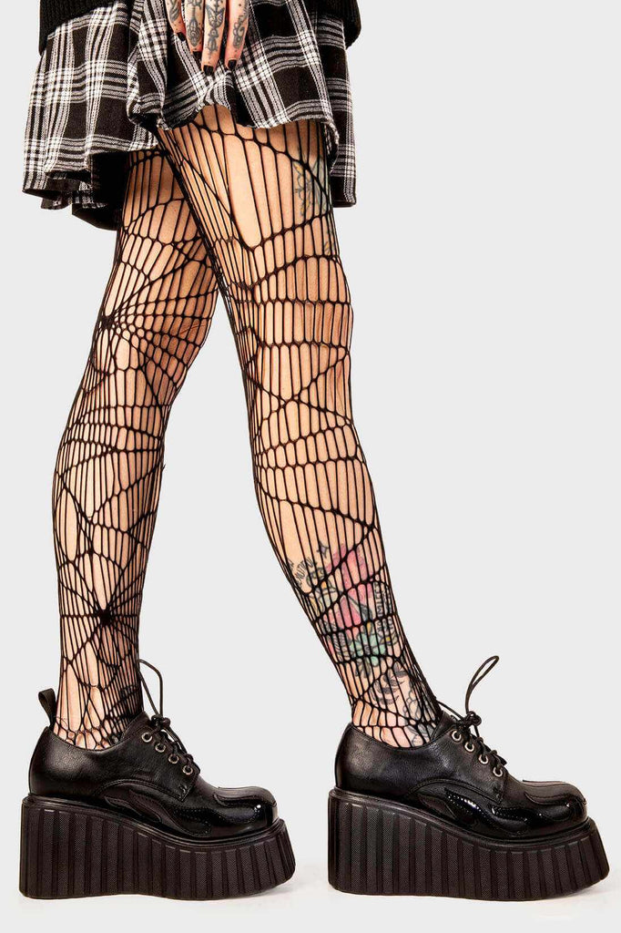 Blaze Runner
 
 Girls On Tour Chunky Platform Creeper Shoes in Black. These black creeper shoes feature a patent black flame across the side of the shoe, stepping on flames and setting hot trends. Made with eco-friendly materials and 100% cruelty-free, these platform boots are as ethical as they are HOT!
 
 - Platform Height
 - Black Laces with black eyelets
 - Patent black flame 
 - Chunky creeper wedge sole
 - Round Toe 
 - 100% vegan 
 
 SKU: LMF 2222 - Black/Flame