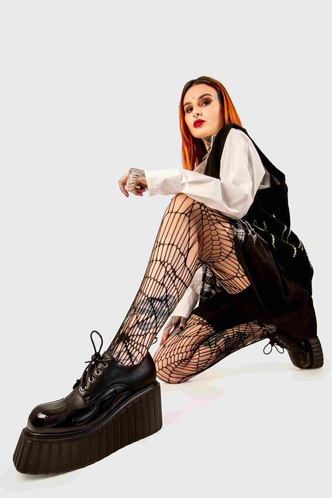 Blaze Runner
 
 Girls On Tour Chunky Platform Creeper Shoes in Black. These black creeper shoes feature a patent black flame across the side of the shoe, stepping on flames and setting hot trends. Made with eco-friendly materials and 100% cruelty-free, these platform boots are as ethical as they are HOT!
 
 - Platform Height
 - Black Laces with black eyelets
 - Patent black flame 
 - Chunky creeper wedge sole
 - Round Toe 
 - 100% vegan 
 
 SKU: LMF 2222 - Black/Flame