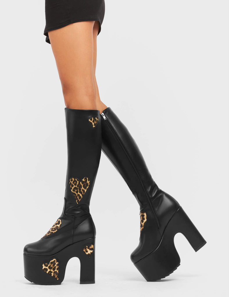 DELICATE LOVER
 
 Glass Heart Chunky Platform Knee High Boots in Black and leopard faux leather. These vegan boots feature faux suede leopard print hearts and a Chunky Platform sole, perfect for adding height and the wow factor to any outfit. Made with eco-friendly materials and 100% cruelty-free!
 
 - Platform Height: 
 - Heel Height:
 - Knee high length
 - Leopard print hearts
 - Black Zipper
 - Chunky Platform Sole
 - Round Toe
 - 100% Vegan
 
 SKU: LMF 5114 - BlackPU/Leo