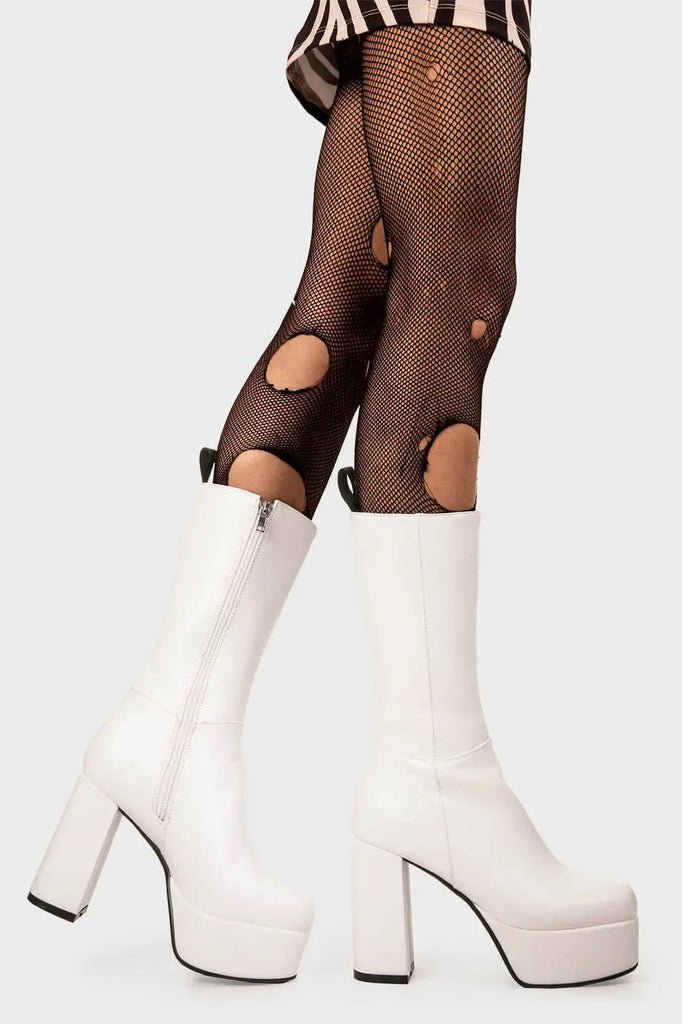 THE TIMELESS ONE
 
 Going Under Platform Calf Boots in White faux leather. These Black vegan Boots feature an elegant clutter free design and a Platform sole and heel, perfect for adding height and style to any outfit. Made with eco-friendly materials and 100% cruelty-free, these boots are as ethical as they are stylish.
 
 
 - Platform Height: 1.25 inch
 - Heel Height: 4.2 inch
 - Calf High length
 - White zipper 
 - Platform sole
 - Round toe 
 - 100% vegan 
 
 SKU: LMF 1209 - WhitePU