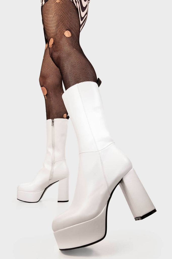 THE TIMELESS ONE
 
 Going Under Platform Calf Boots in White faux leather. These Black vegan Boots feature an elegant, minimalist design and a Platform sole and heel, perfect for adding height and style to any outfit. Made with eco-friendly materials and 100% cruelty-free, these boots are as ethical as they are stylish.
 
 
 - Platform Height: 1.25 inch
 - Heel Height: 4.2 inch
 - Calf High length
 - White zipper 
 - Platform sole
 - Round toe 
 - 100% vegan 
 
 SKU: LMF 1209 - WhitePU