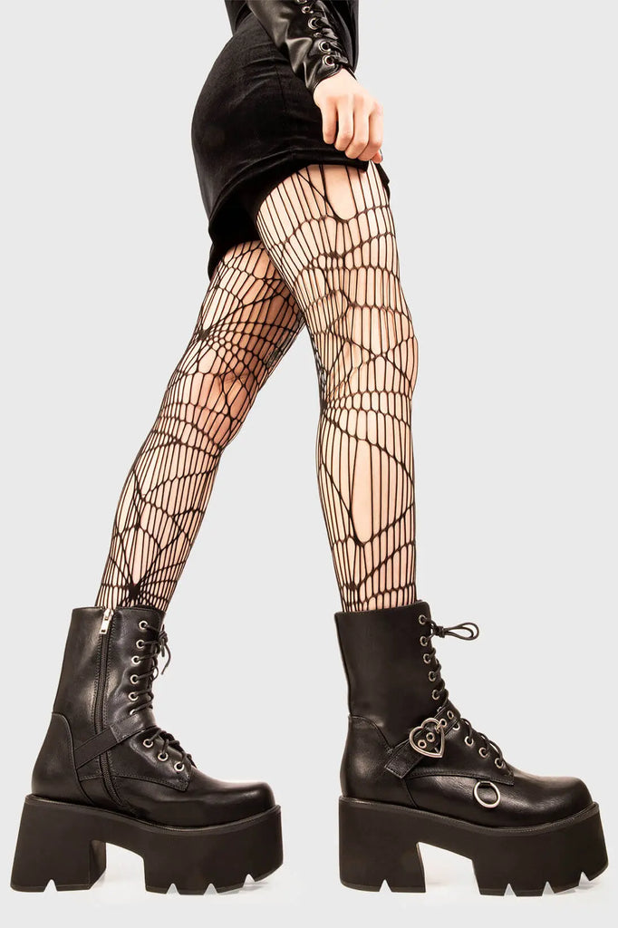 Ice Cold.
 
 Heartles Chunky Platform Boots in Black faux leather. These black vegan Platform Boots feature lace up detail with a black strap across the upper with a silver heart shaped buckle, will leave them begging for more. Made with eco-friendly materials and 100% cruelty-free!
 
 
 - Platform Height: 3 inch
 - Black laces silver eyelets 
 - Black strap silver heart buckle
 - Black Zipper 
 - Silver 'O' ring on the side 
 - Chunky Platform sole
 - Round Toe
 - 100% vegan 
 
 SKU: LMF 1846 - BlackPU