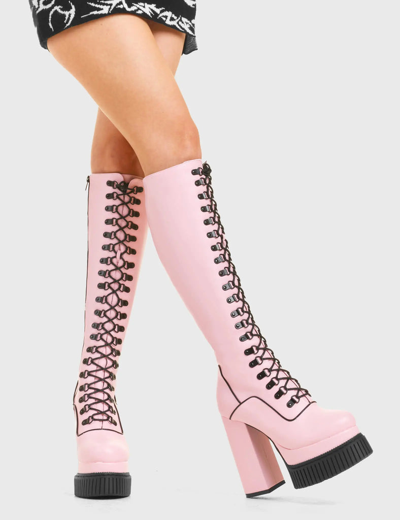 HIGH IN THE SKY
 
 Hidden Agenda Creeper Platform Knee High Boots in Pink faux leather. These vegan western Boots feature a lace up design and Black stitch detailing. Made with eco-friendly materials and 100% cruelty-free, these boots are as ethical as they are trendy!
 
 
 - Heel Height 
 - Knee high length
 - Black stitching
 - Black zip 
 - Rubber grip sole
 - Rounded toe 
 - 100% vegan 
 
 SKU: LMF 3968 - PinkPU