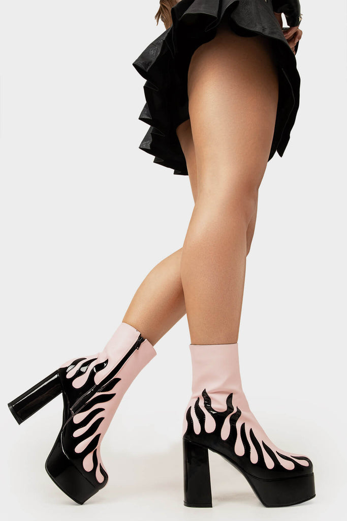 Power Up.
 
 High Voltage Platform Ankle Boots in Pink. These vegan Platform Boots feature a patent black flame sole and heel, charging up your shoe game. Made with eco-friendly materials and 100% cruelty-free, these Boots are as ethical as they are shockingly stylish!
 
 - Platform Height: 1.25 inch
 - Heel Height: 4.2 inch
 - Patent Black flame
 - Black Zipper
 - Platform sole
 - Round toe
 - 100% vegan
 
 SKU: LMF 1566 - PinkPU
