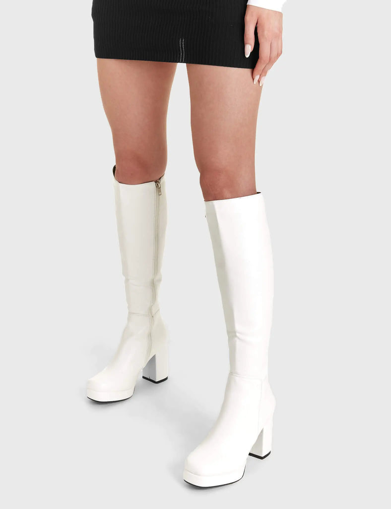 Elegant Entrancers
 
 Humble Platform Knee High Boots in White faux leather. These white Platform Boots feature on our platform sole with gusset detail to the back of the boot, perfect for any occasion. Made with eco-friendly materials and 100% cruelty-free, these platform boots are as ethical as they are Elegant! 
 
 - Platform Height
 - Heel Height
 - Gusset detail
 - Black zip
 - Wide ankle and calf friendly
 - Platform sole
 - Square Toe 
 - 100% vegan 
 
 SKU: LMF 2179 - White