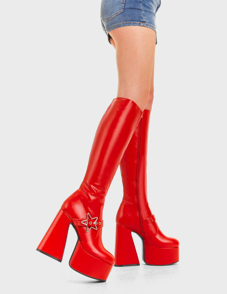 KEEPING IN CUTE
 
 I'm Your Star Platform Knee High Boots in Red faux leather. These platform boots feature a minimalist look with a silver star buckle. Made with eco-friendly materials and 100% cruelty-free, these platform boots are as ethical as they are chic.
 
 - Platform Height
 - Knee high 
 - Silver star buckle
 - Flared heel
 - High Heel
 - 100% vegan 
 
 SKU: LMF 3359 - RedPU