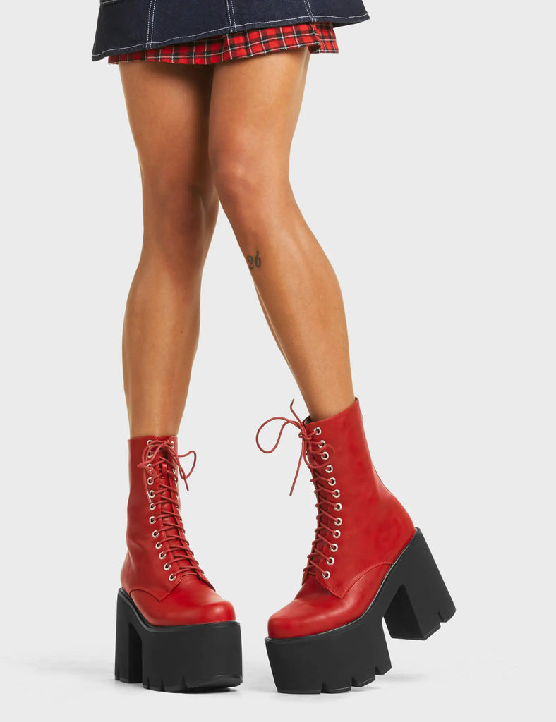 A WONDER
 
 Iconic Chunky Platform Ankle Boots in Dark Red faux leather. These platform boots feature a lace-up design with a functional back zip, the perfect way to elevate any outfit. Made with eco-friendly materials and 100% cruelty-free, these platform boots are as ethical as they are eye-catching.
 
 - Platform Height
 - Heel Height
 - Lace Up
 - Silver Eyelets
 - Back Zip
 - Chunky Platform Sole
 - 100% vegan
 
 SKU: LMF 5015 - DarkRedPU