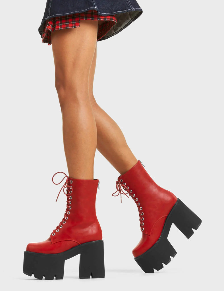 A WONDER
 
 Iconic Chunky Platform Ankle Boots in Dark Red faux leather. These platform boots feature a lace-up design with a functional back zip, the perfect way to elevate any outfit. Made with eco-friendly materials and 100% cruelty-free, these platform boots are as ethical as they are eye-catching.
 
 - Platform Height
 - Heel Height
 - Lace Up
 - Silver Eyelets
 - Back Zip
 - Chunky Platform Sole
 - 100% vegan
 
 SKU: LMF 5015 - DarkRedPU