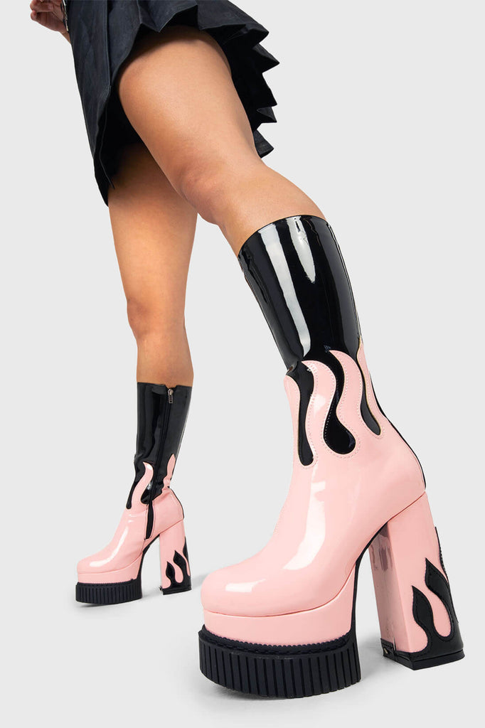 SIZZLING STOMPERS
 
 Ignite Platform Calf Boots in Black Patent. These vegan Platform Boots feature a pink patent flame sole with a black Patent flame on the heel igniting your outfit. Made with eco-friendly materials and 100% cruelty-free, these Boots are as ethical as they are HOT!
 
 - Platform Height: 2 inch
 - Heel Height: 5.5 inch
 - Patent pink flame sole
 - Patent black flame on heel 
 - Platform creeper sole
 - Black Zipper
 - Round toe 
 - 100% vegan 
 
 SKU: LMF 1576 - Black/Pink