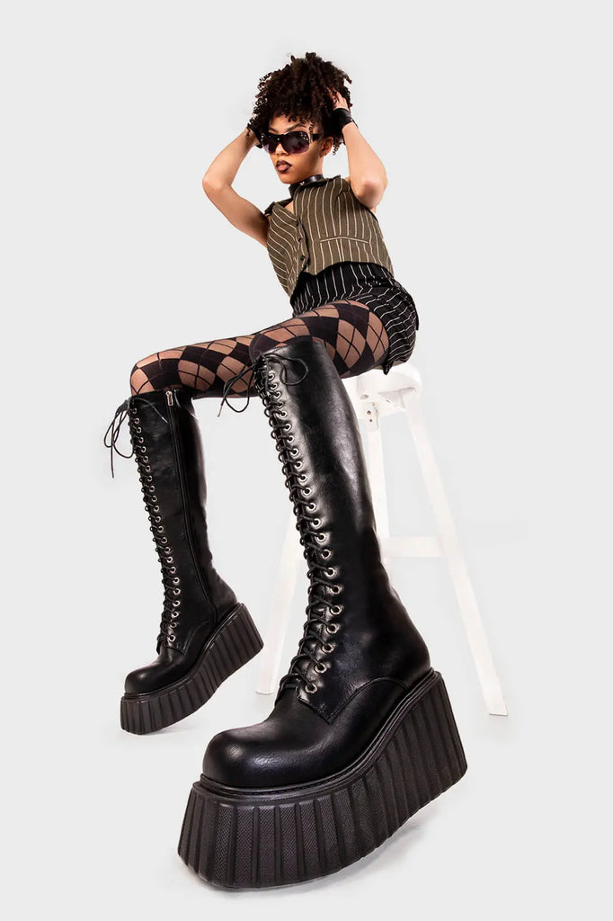 Lace Obsessed
 
 Important Chunky Creeper Platform Knee High Boots in Black faux leather. These black platform boots feature adjustable black lace up detail, turn heads with each step. Made with eco-friendly materials and 100% cruelty-free, these platform boots are as ethical as they are Hot!
 
 - Platform Height
 - Black zipper
 - Blace laces with silver eyelets
 - Chunky platform creeper wedge sole
 - Round Toe 
 - 100% vegan 
 
 SKU: LMF 2217 - BlackPU