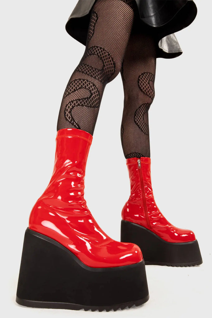 Platform Staples
 
 Lights Out Chunky Platform Ankle Boots in Red Patent faux leather. These red platform boots feature on our chunky platform wedge sole, step up your shoes game! Made with eco-friendly materials and 100% cruelty-free, these platform boots are as ethical as they are Fashion Staples!
 
 - Platform Height
 - Red Zip
 - Chunky Platform wege sole
 - Shark's teeth rubber grip
 - Round Toe 
 - 100% vegan 
 
 SKU: LMF 2369 - RedPAT
