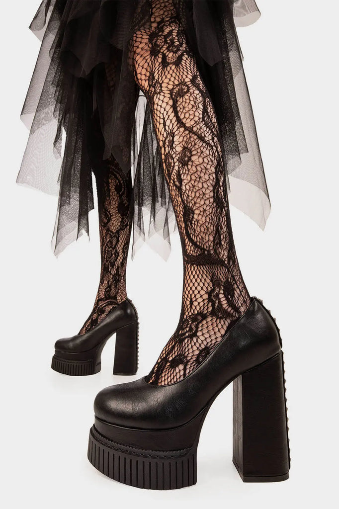 DARK LEMONADE
 
 Lyrical Creeper Platform Heels in Black faux leather. These vegan creeper platform heels feature a chic and minimalist design with studs on the back heel, very edgy. Made with eco-friendly materials and 100% cruelty-free, these heels are as ethical as they are trendy!
 
 
 - Heel Height
 - Platform Height
 - Back Studs
 - Platform Sole
 - Creeper Sole
 - Rounded toe
 - 100% vegan
 
 SKU: LMF 1568 - BlackPU