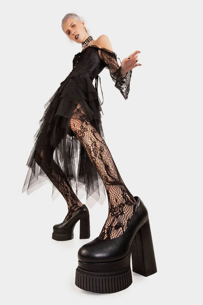 DARK LEMONADE
 
 Lyrical Creeper Platform Heels in Black faux leather. These vegan creeper platform heels feature a chic and minimalist design with studs on the back heel, very edgy. Made with eco-friendly materials and 100% cruelty-free, these heels are as ethical as they are trendy!
 
 
 - Heel Height
 - Platform Height
 - Back Studs
 - Platform Sole
 - Creeper Sole
 - Rounded toe
 - 100% vegan
 
 SKU: LMF 1568 - BlackPU