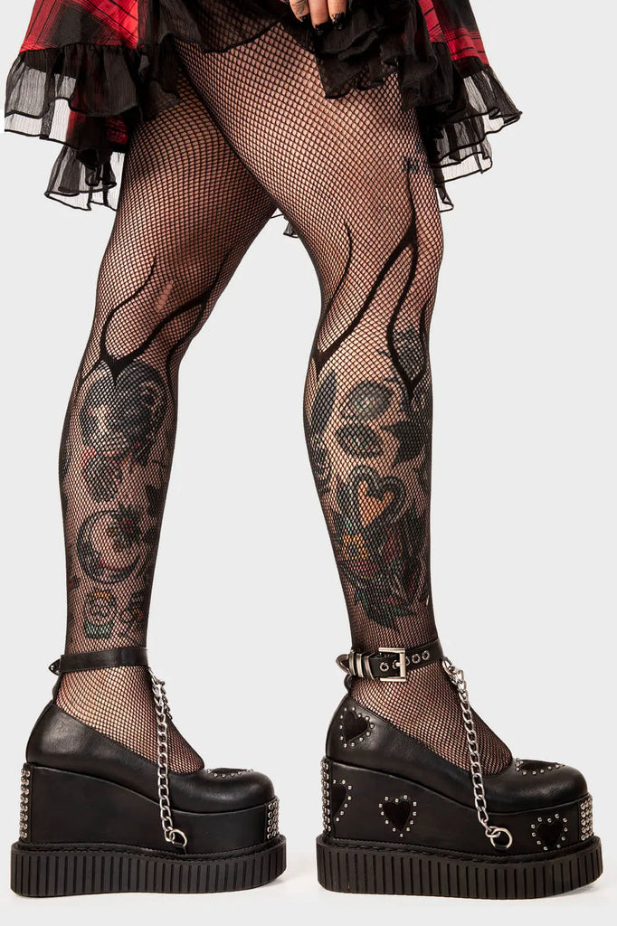 Royal Elegance
 
 Majesty Chunky Platform Creeper shoes in black faux leather. These black vegan Platform shoes feature black suede hearts throughout with a perimeter of silver studs and a black ankle strap featuring a silver hanging chain, reach new heights of style and authority.
 
 
 - Platform Height
 - Heel Height 
 - Sqaure buckles 
 - Silver studs
 - Black suede hearts
 - Silver chain 
 - Black strap with silver eyelets
 - Chunky creeper sole
 - Round Toe
 - 100% vegan 
 
 SKU: LMF 2116 - Black/Heart